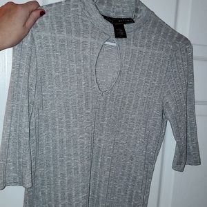 Grey 3/4 sleeve shirt. Almost crop style.